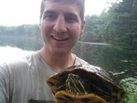 NAP Herpetologist, Patrick Terry, with a Red-Eared Slider