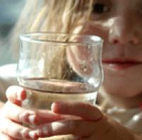 Image of child holding a water glass
