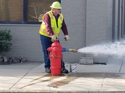Public works staff flushing a hydrant in Ann Arbor.jpg