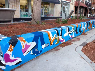 A2AC Murals and Planters 2025 Golden Paintbrush award winner art on knee high wall